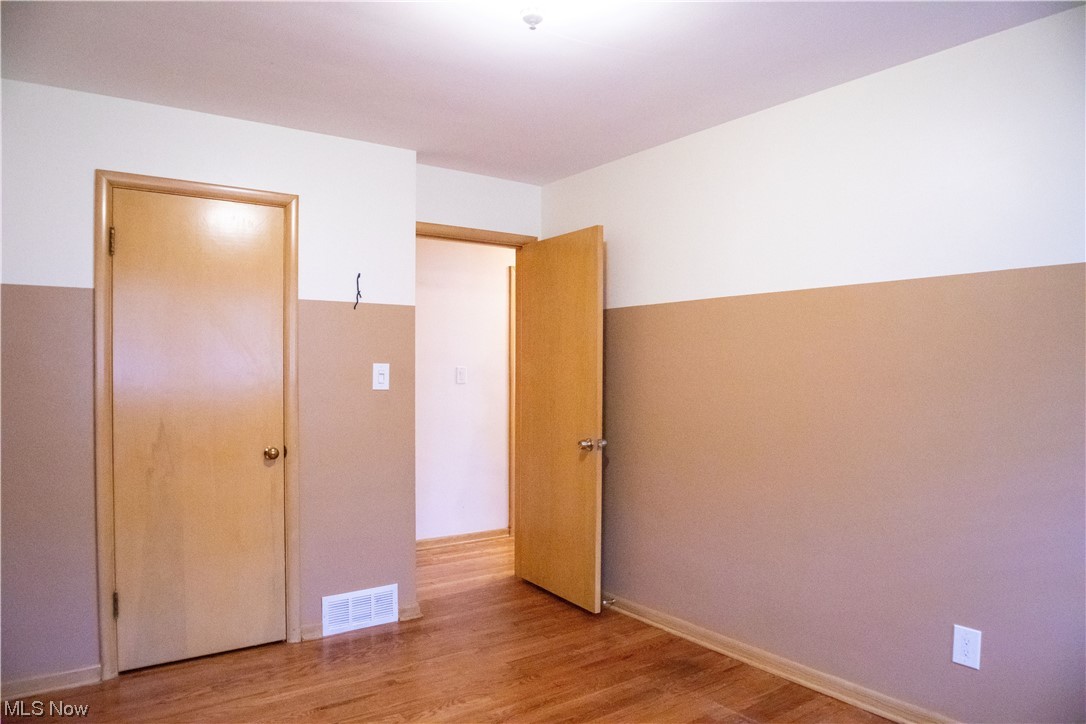 7674 Ragall Parkway Cleveland, OH 44130 - Photo 16 of 32 bedroom with a closet and light hardwood flooring