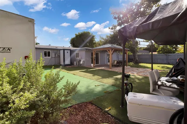 a view of a house with a yard porch and sitting area