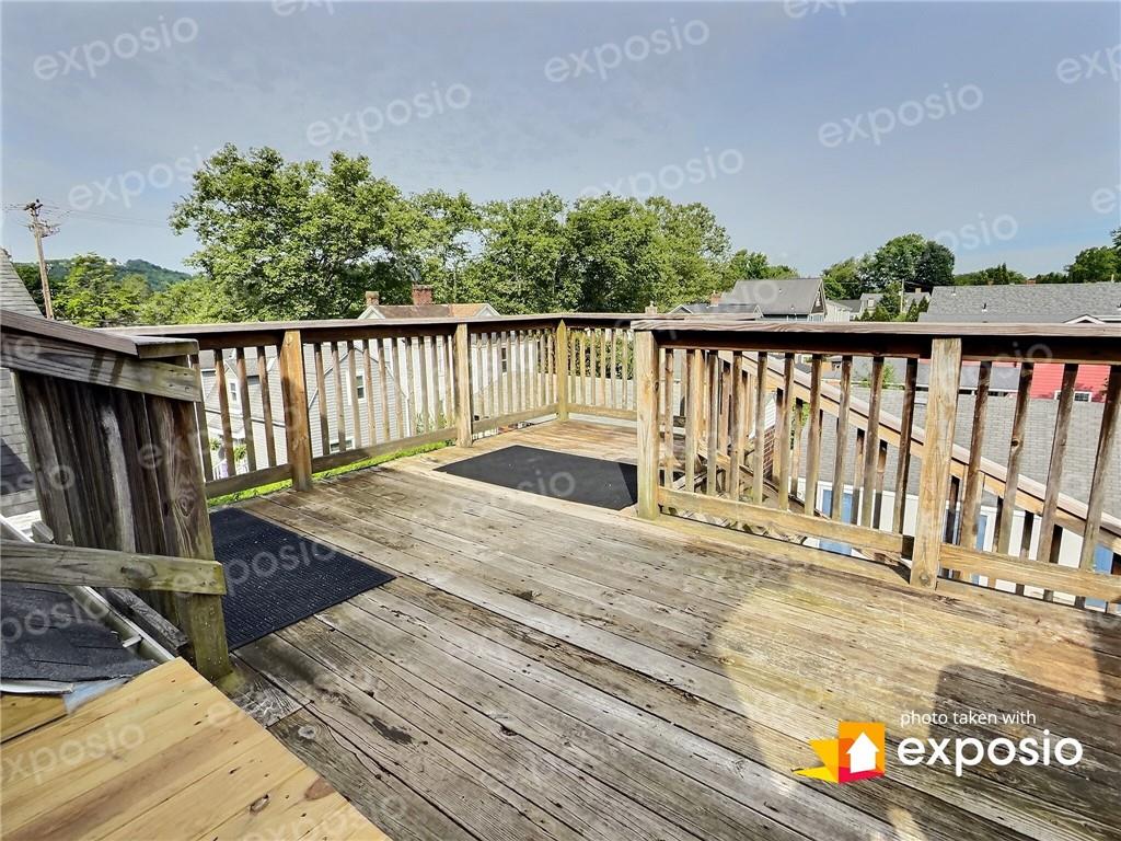 611 Blackburn Road, Unit 3 Sewickley, PA 15143 - Photo 13 of 16 a view of a balcony with wooden floor