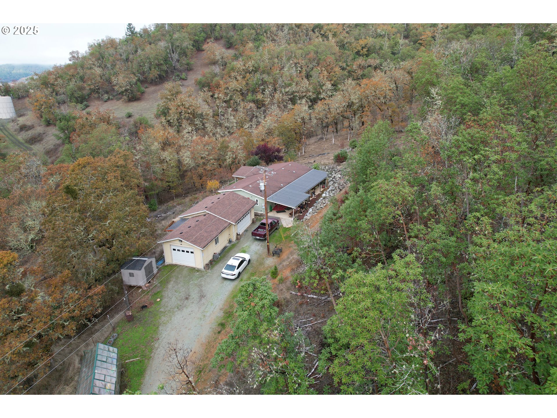 a view of a city with lush green forest