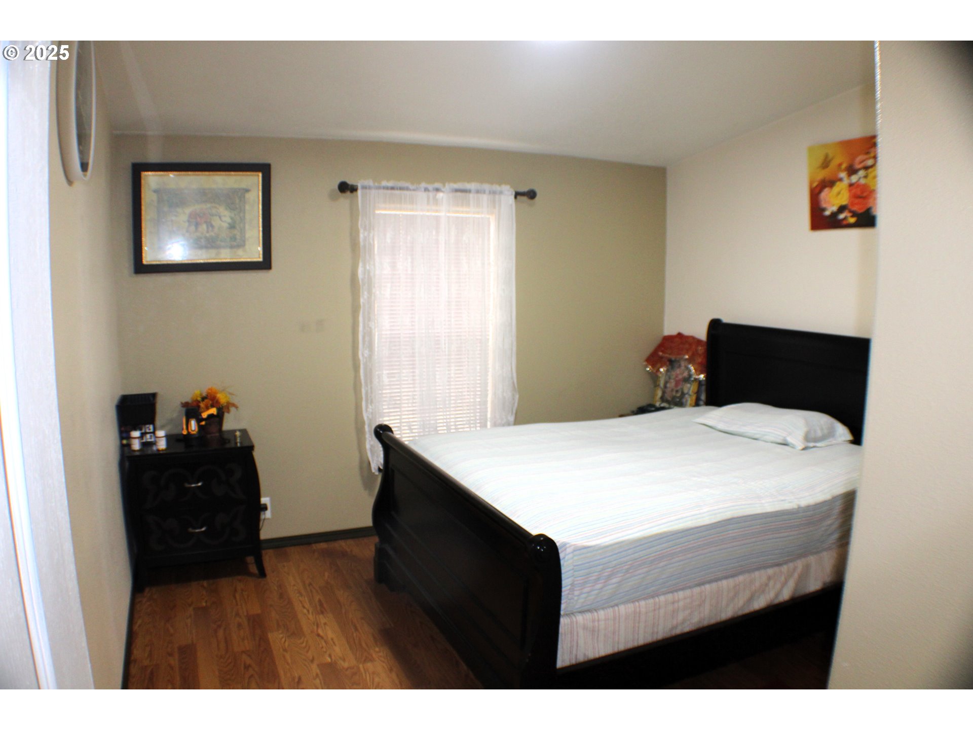 1320 Shoestring Road Riddle, OR 97469 - Photo 19 of 48 a kitchen with a wooden floor and cabinets