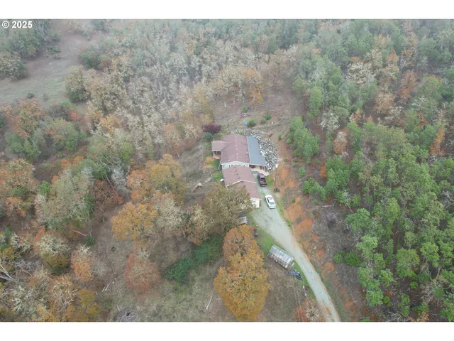a aerial view of a house with a yard