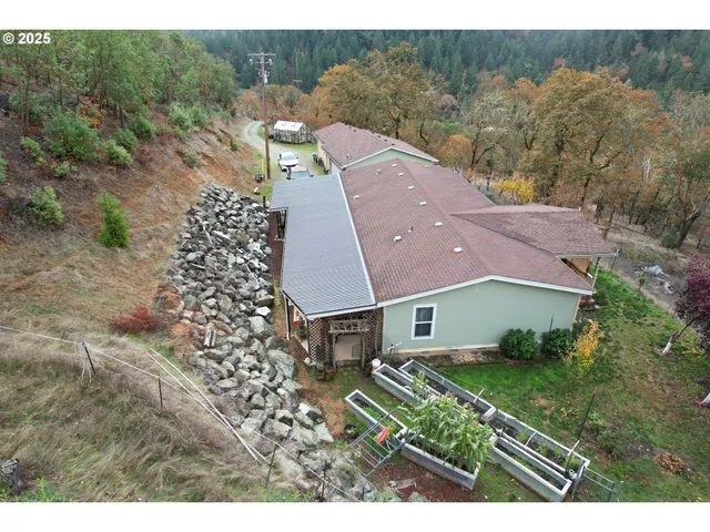 a aerial view of a house with a yard