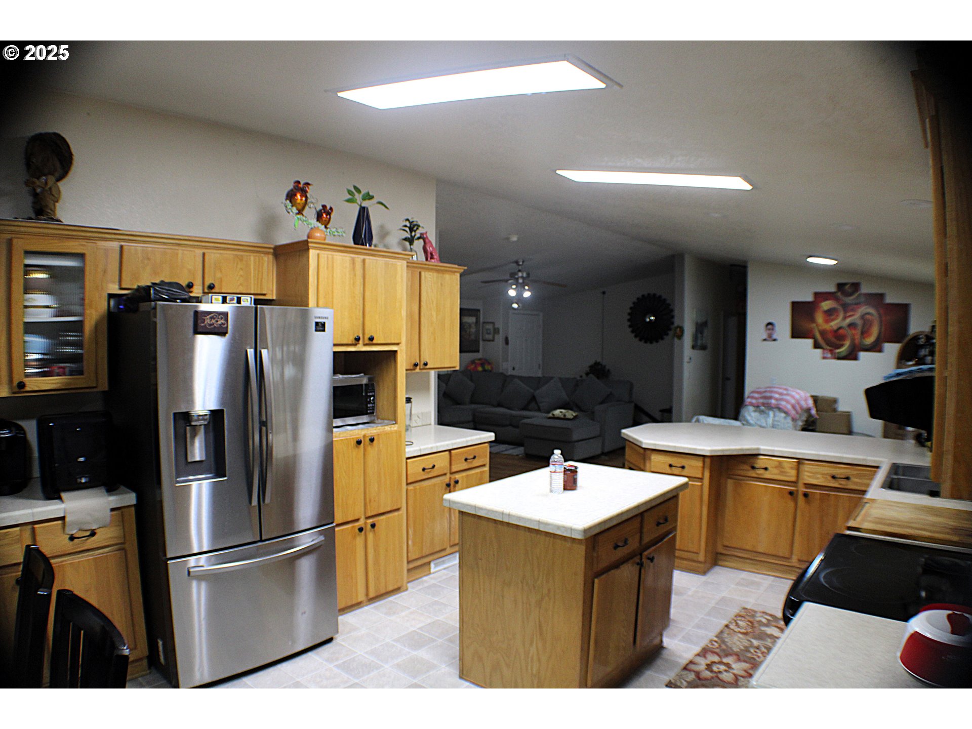 1320 Shoestring Road Riddle, OR 97469 - Photo 9 of 48 a kitchen with stainless steel appliances a sink a stove a refrigerator and cabinets