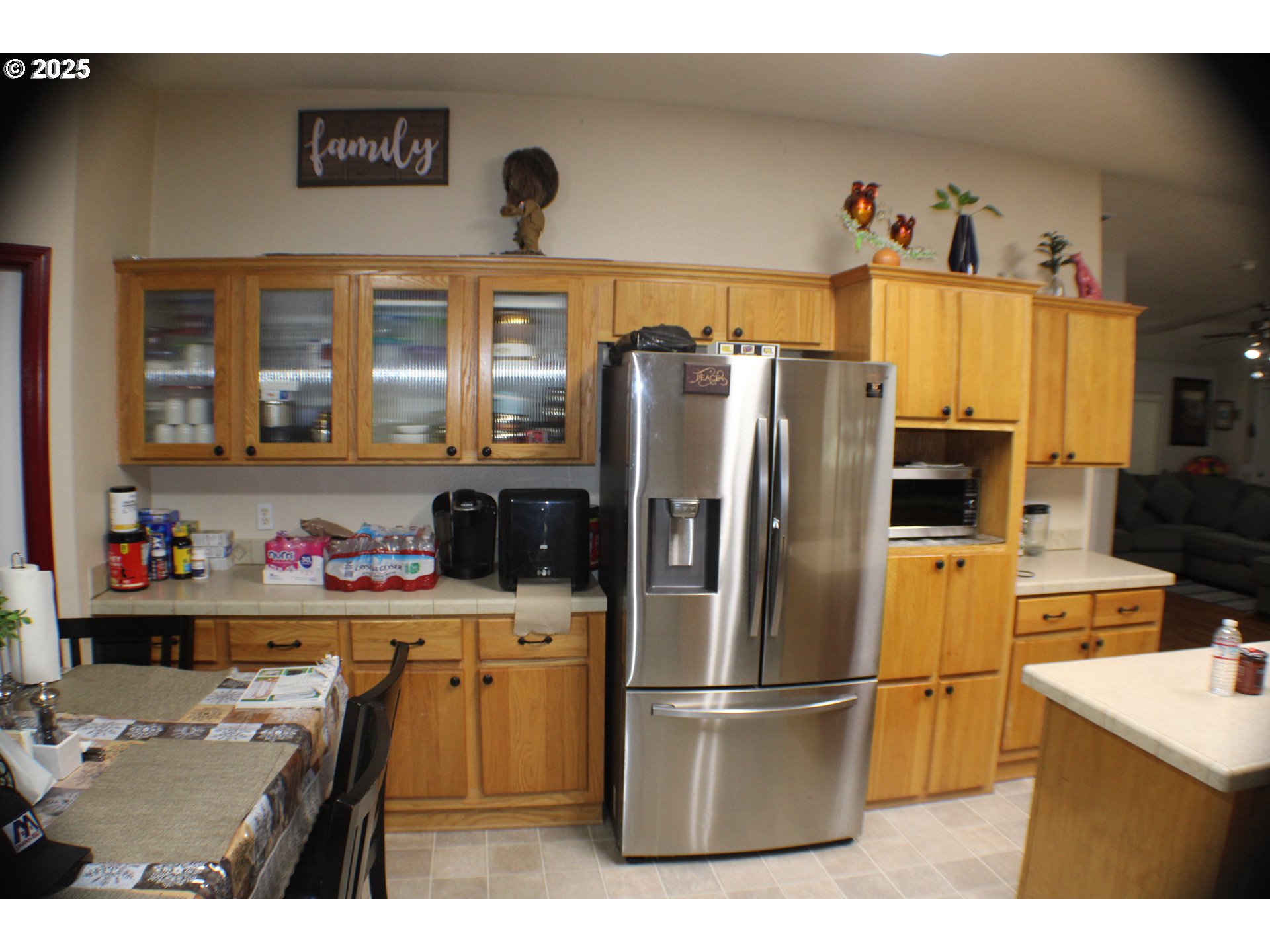1320 Shoestring Road Riddle, OR 97469 - Photo 10 of 48 a kitchen with a refrigerator a stove top oven a sink and cabinets