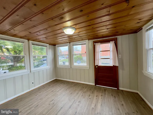 a view of a street with a big yard