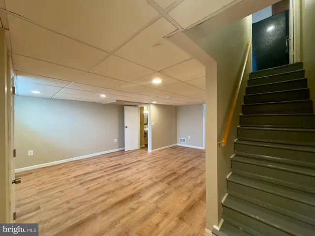 a view of an empty room with stairs