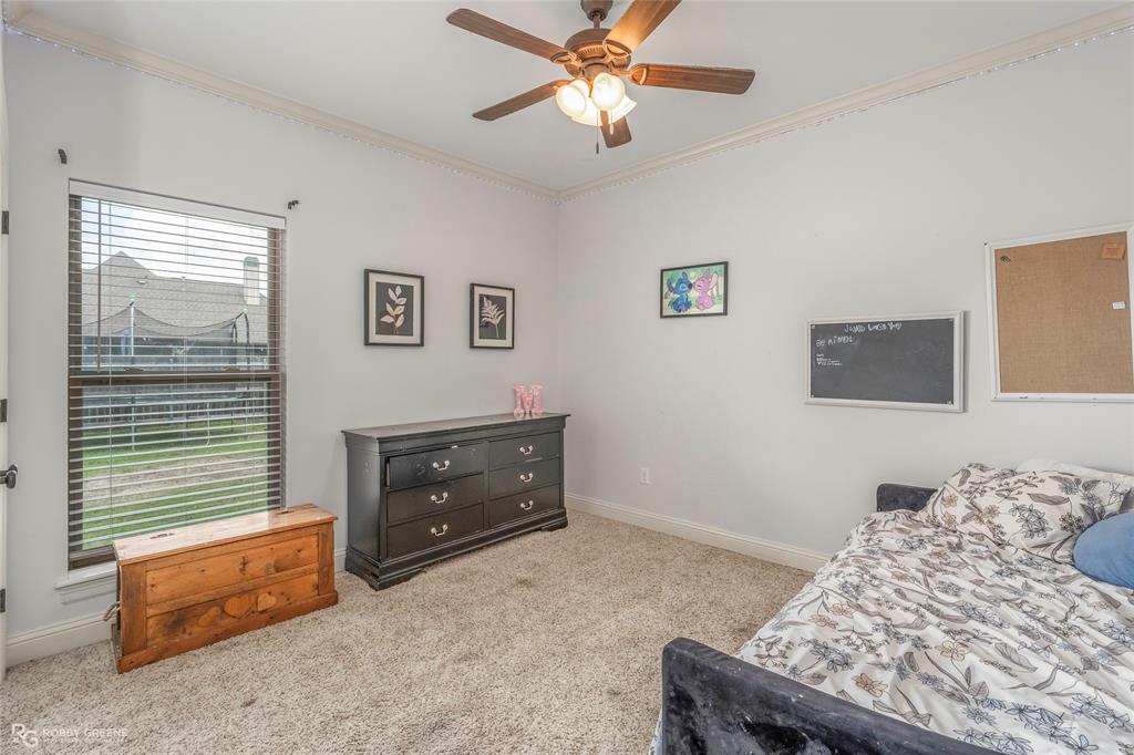 711 Reeds Reef Bossier City, LA 71112 - Photo 22 of 36 a bedroom with a bed and a television