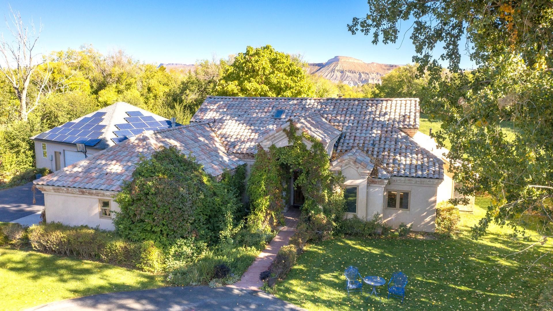 3310 C Road Palisade, CO 81526 - Photo 1 of 41 a view of a big yard with large trees