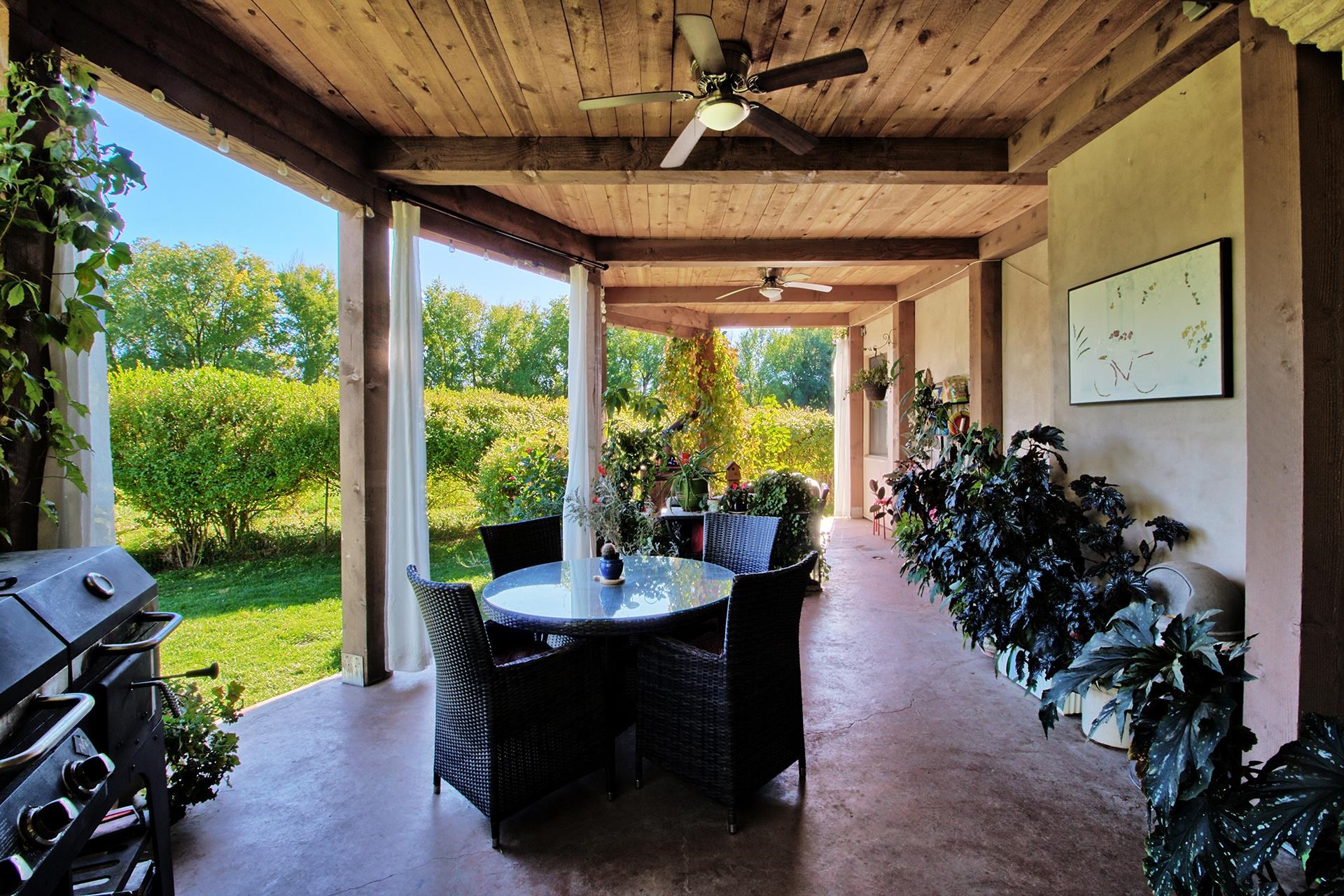 3310 C Road Palisade, CO 81526 - Photo 11 of 41 a outdoor dining space with furniture and garden view