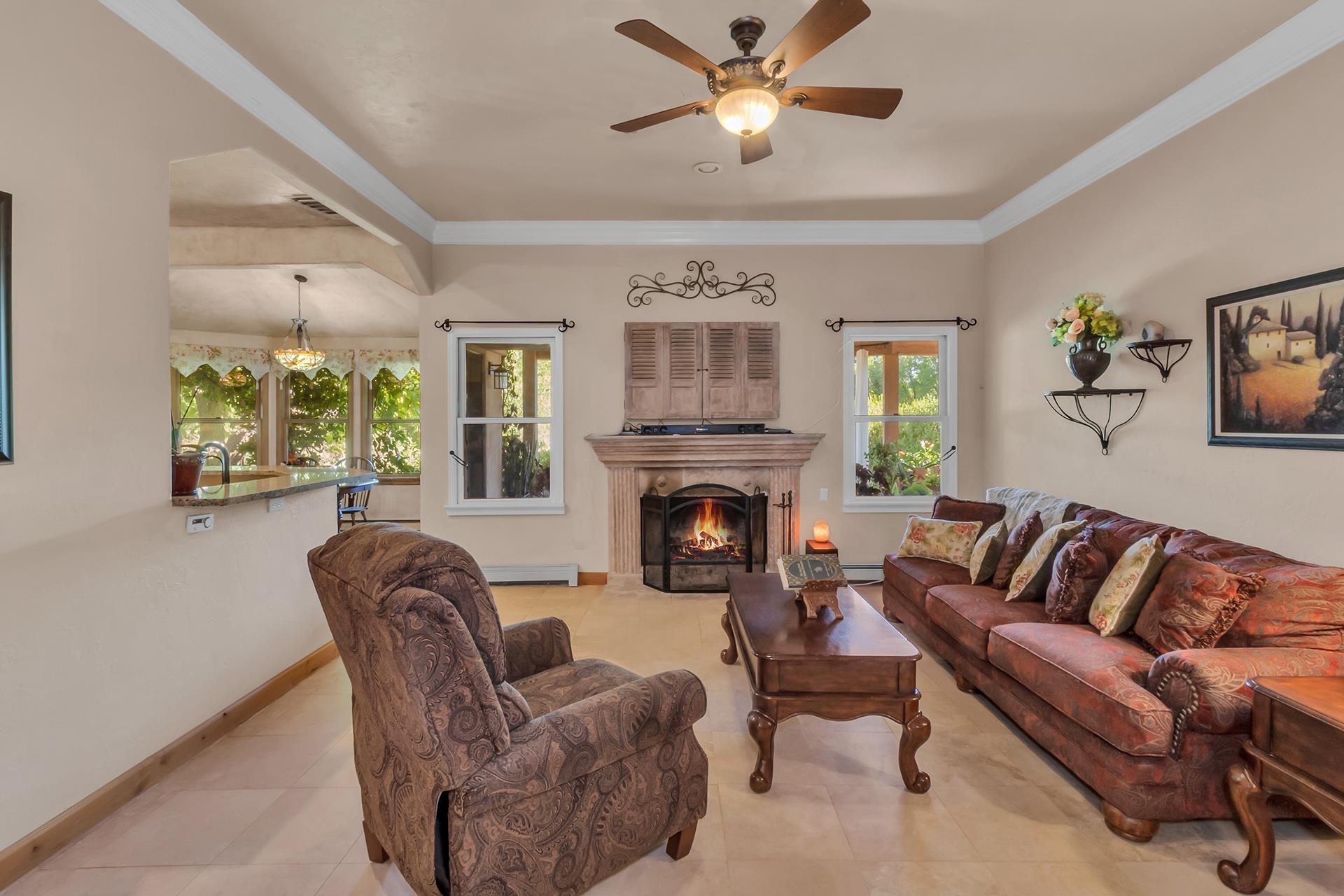3310 C Road Palisade, CO 81526 - Photo 17 of 41 a living room with furniture and a fireplace