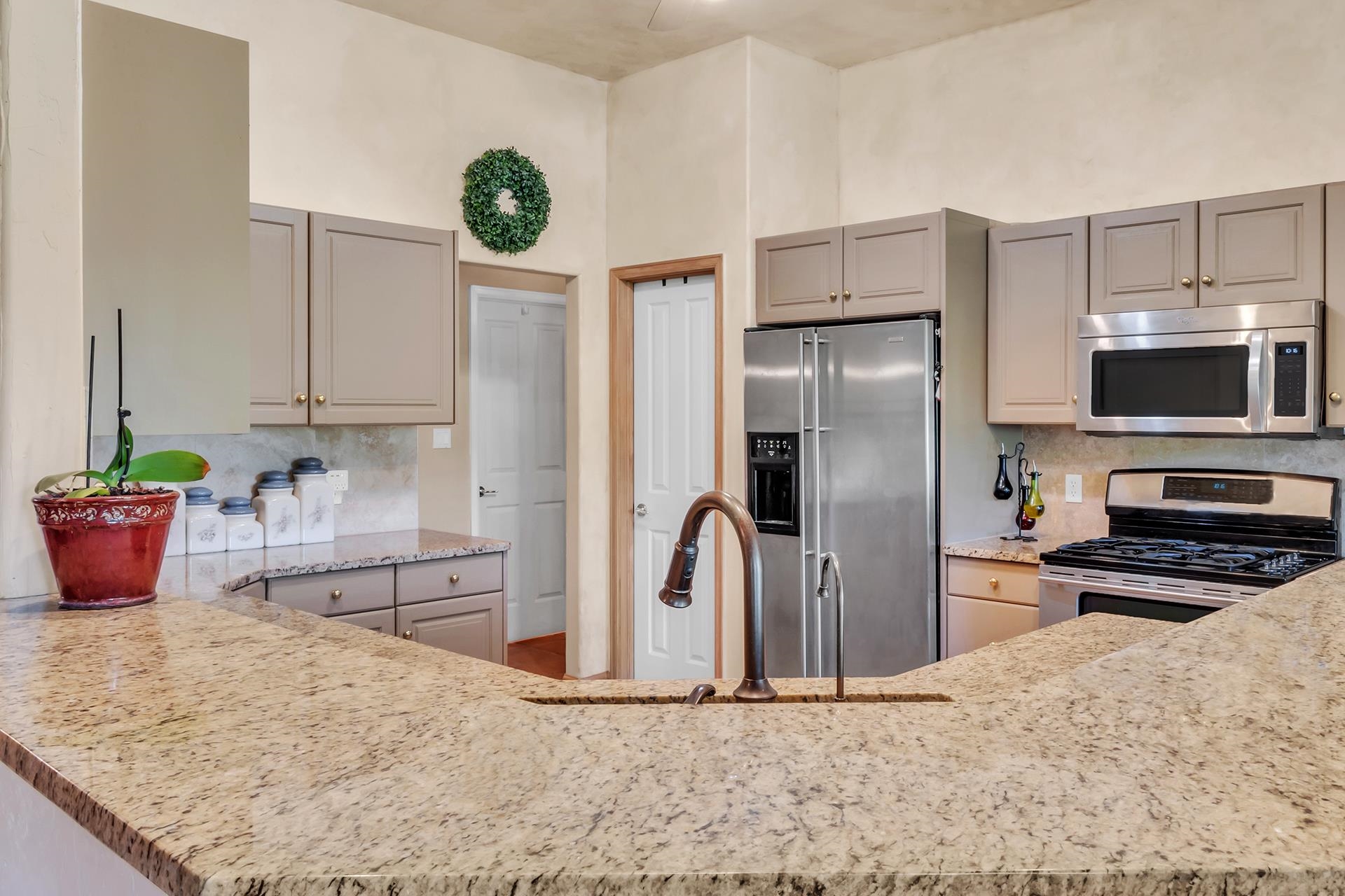 3310 C Road Palisade, CO 81526 - Photo 20 of 41 a kitchen with stainless steel appliances granite countertop a refrigerator a stove and a sink