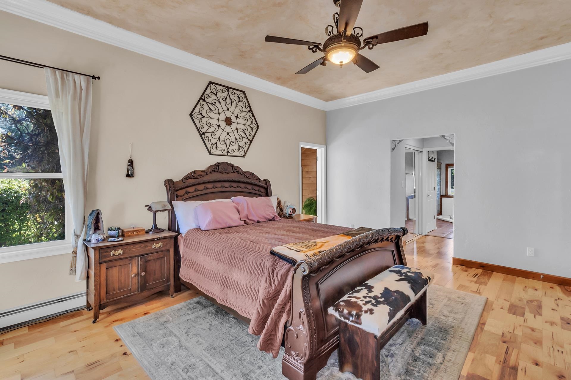 3310 C Road Palisade, CO 81526 - Photo 27 of 41 a bedroom with a bed and a chandelier