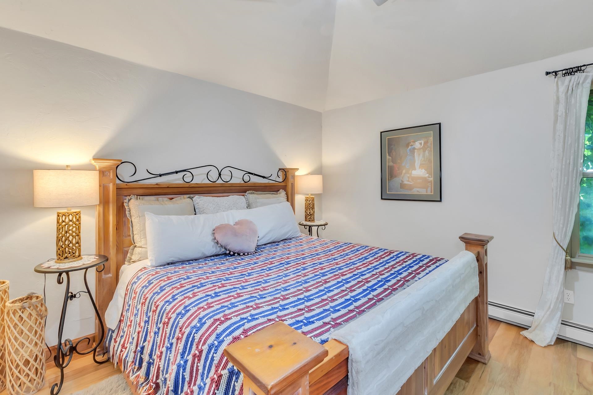 3310 C Road Palisade, CO 81526 - Photo 31 of 41 a bedroom with a bed and wooden floor