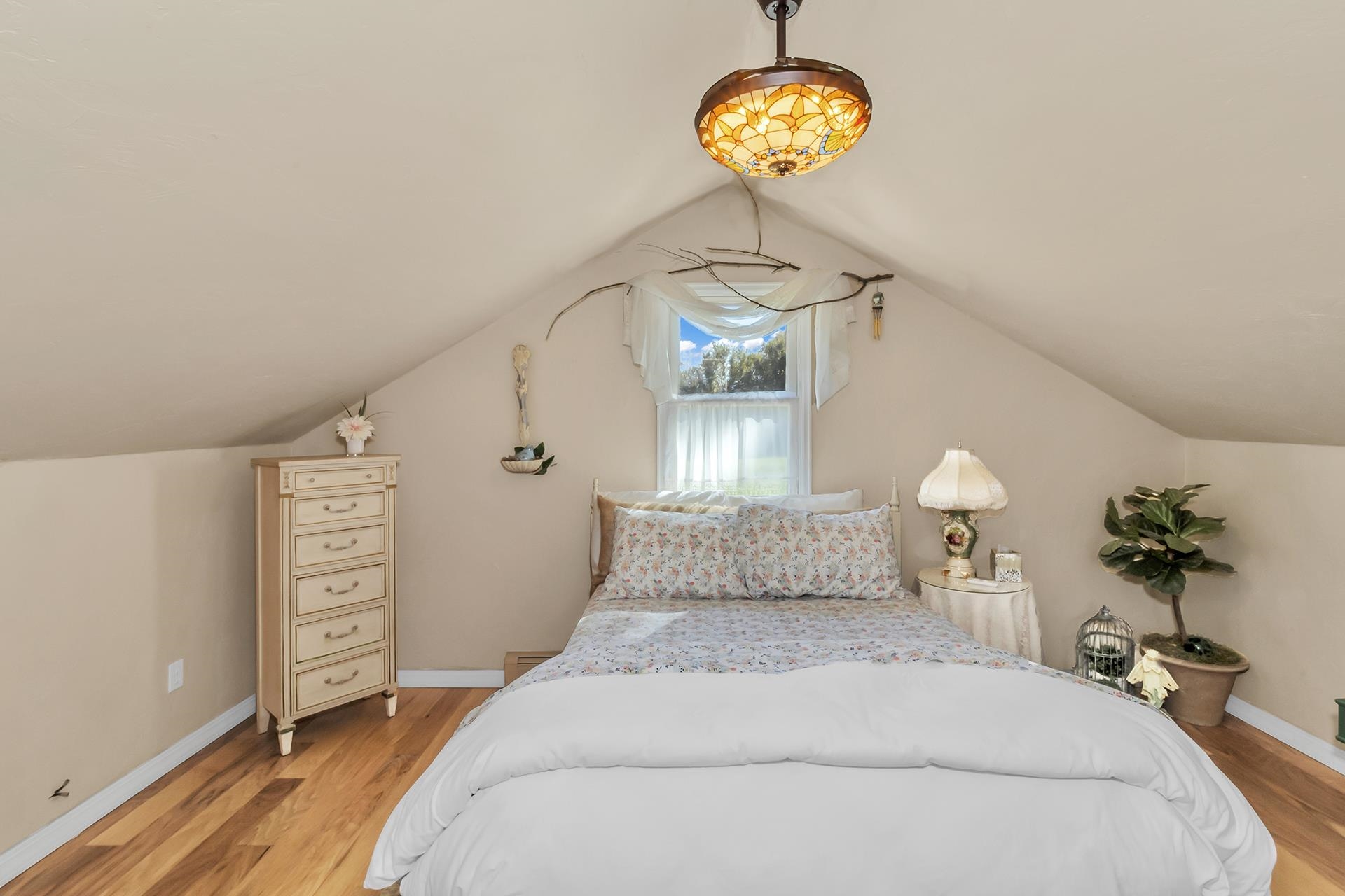 3310 C Road Palisade, CO 81526 - Photo 41 of 41 a bedroom with a bed and a chandelier