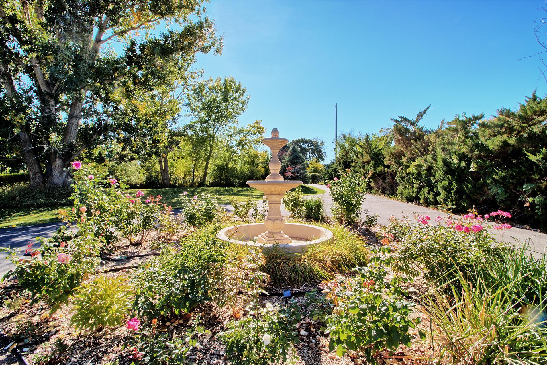 3310 C Road Palisade, CO 81526 - Photo 6 of 41 a view of a backyard with plants and a lake