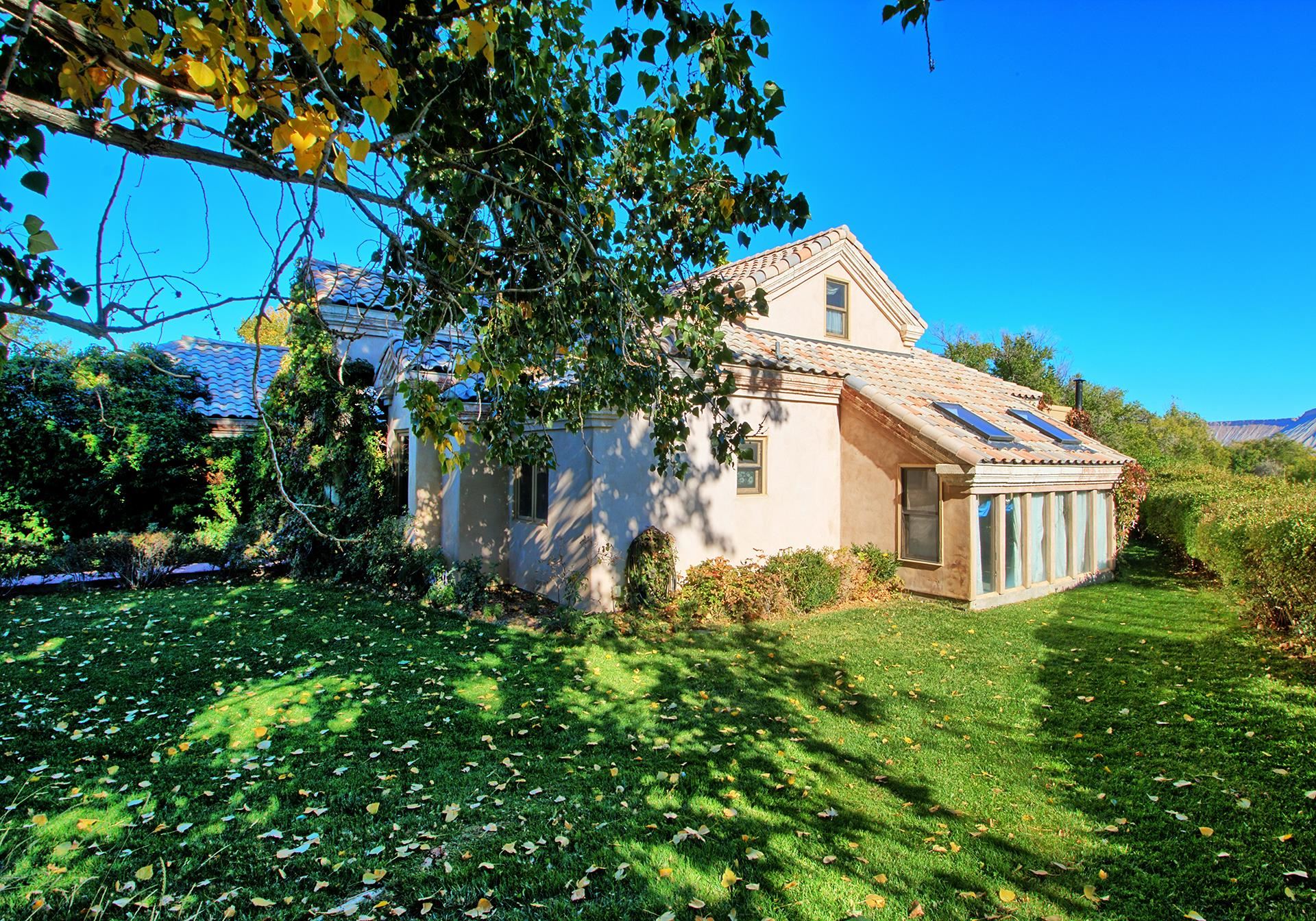 3310 C Road Palisade, CO 81526 - Photo 7 of 41 a house view with a garden space