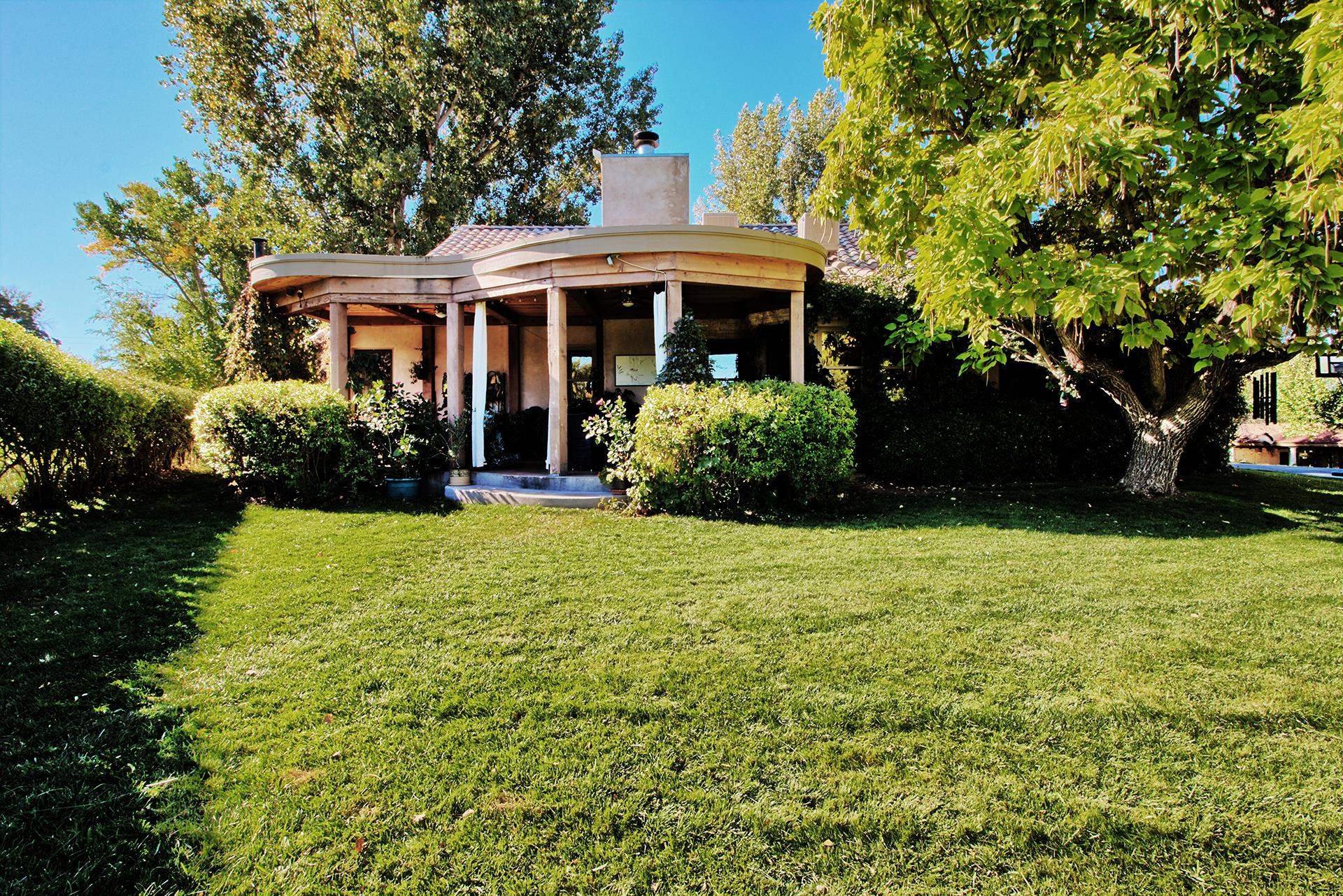 3310 C Road Palisade, CO 81526 - Photo 10 of 41 a front view of a house with a garden