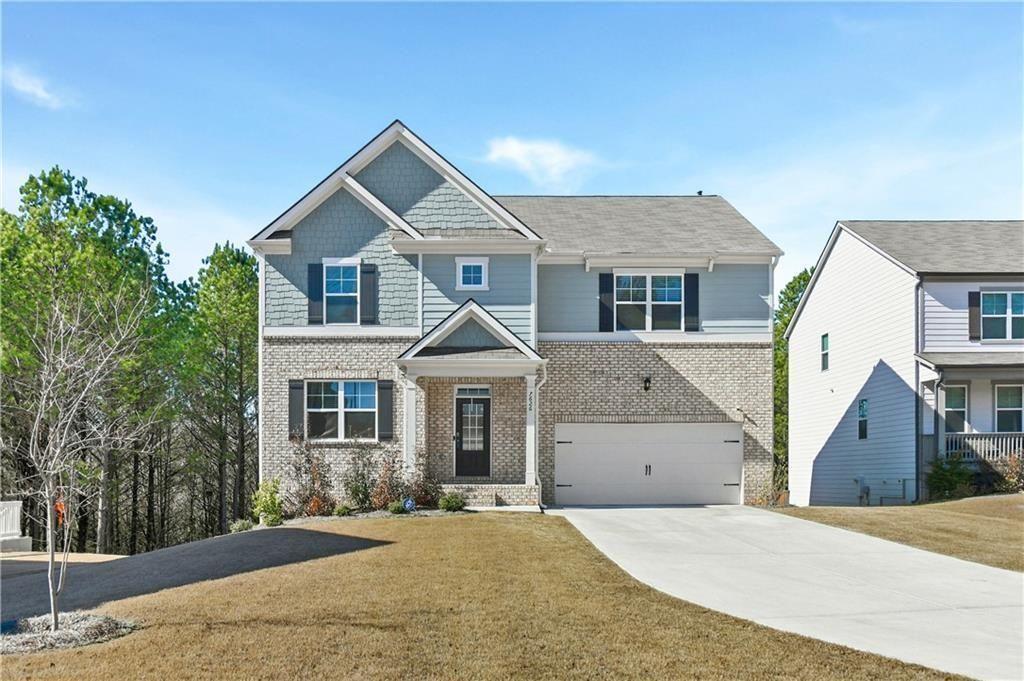 front view of a house with a yard