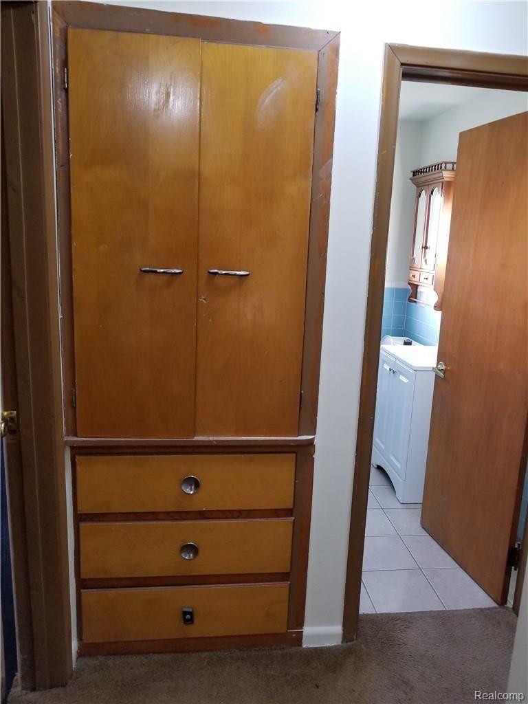 2923 East Square Lake Road Troy, MI 48085 - Photo 9 of 21 Built in Cabinets in Hallway next to Bathroom.....