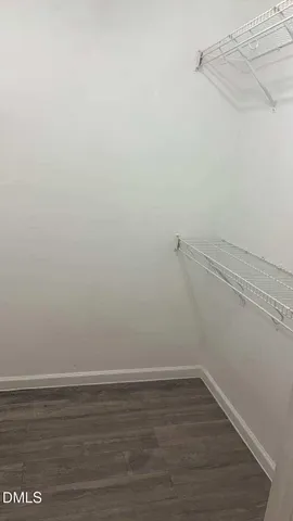 a view of a room with racks on the wall