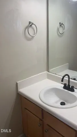 a bathroom with a sink and vanity