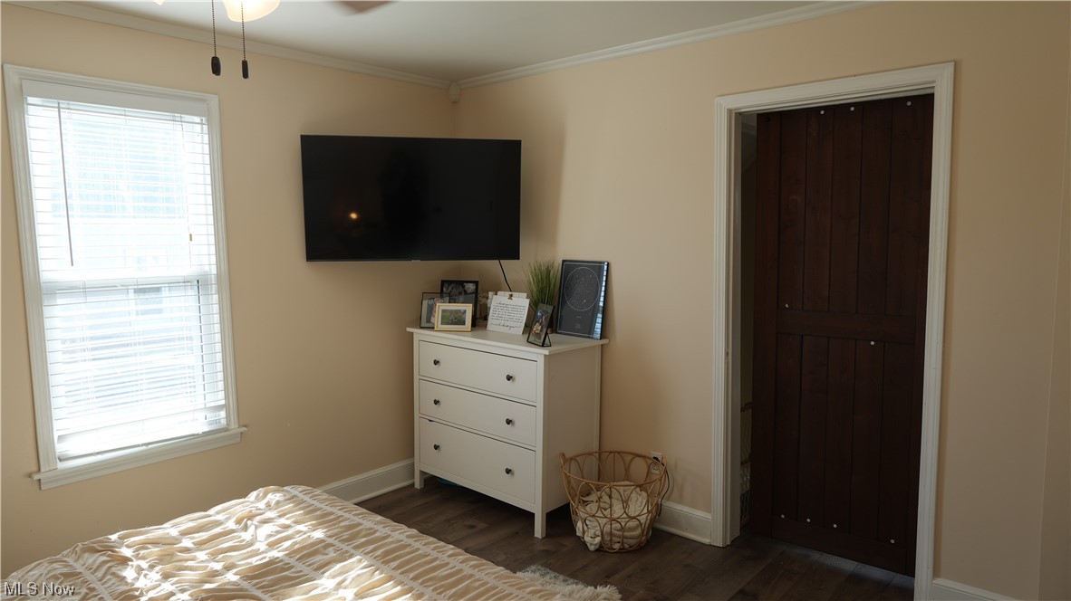 174 Powers Road Weirton, WV 26062 - Photo 26 of 33 Bedroom with a closet, ornamental molding, and dark hardwood / wood-style floors