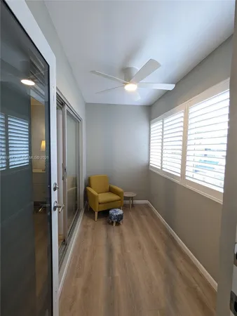a living room with a bed furniture and a window