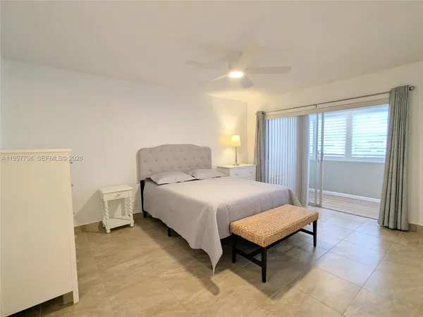 a bedroom with a bed and a table
