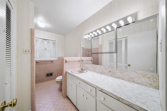 a bathroom with a sink double vanity and a mirror