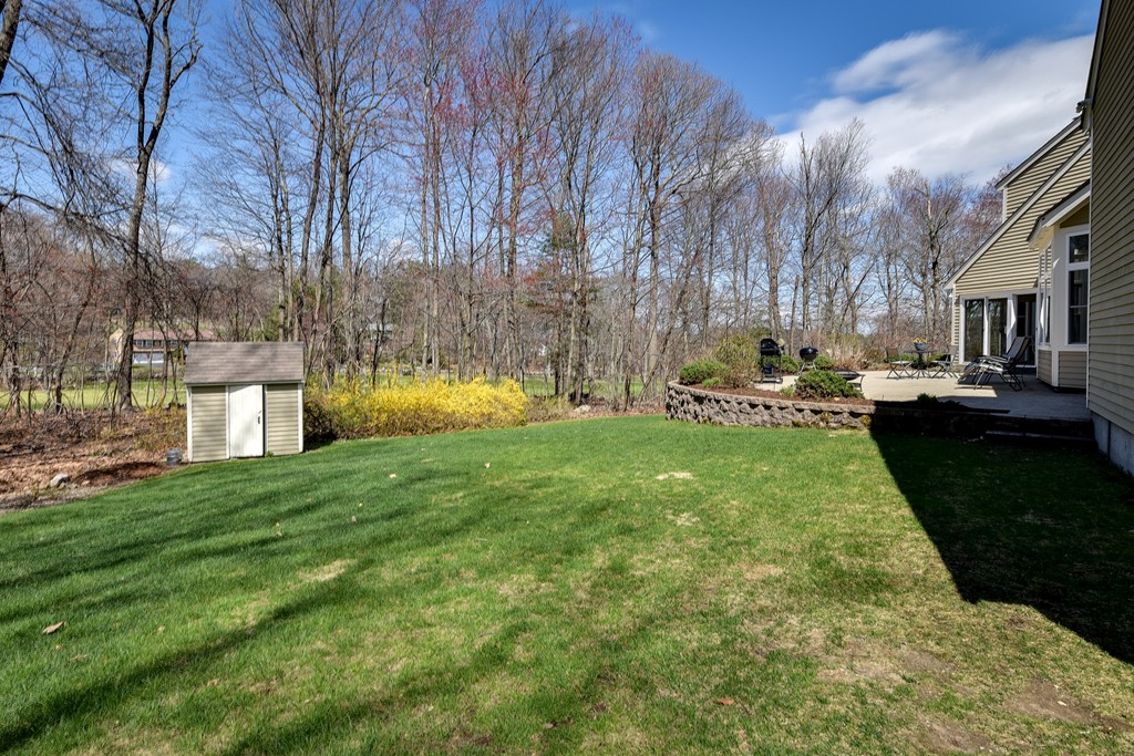 929 Salem End Road Framingham, MA 01702 - Photo 28 of 29 a view of a fountain in front of a house