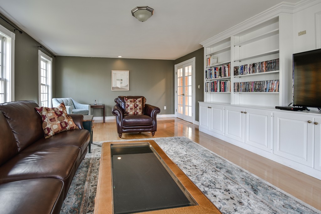 929 Salem End Road Framingham, MA 01702 - Photo 10 of 29 a living room with furniture and a flat screen tv