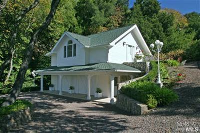 1820 Calistoga Road Santa Rosa, CA 95404 - Photo 5 of 12 a front view of a house with a yard and garage