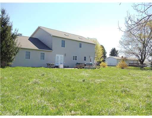 118 Smith Road Sarver, PA 16055 - Photo 2 of 10 Other. REAR VIEW OF HOME, LEVEL LOT, PARTIALLY FENCED, FRENCH DOORS LEADING FROM BREAKFAST AREA TO STAMPED PATIO AND SUMMER FESTIVITIES