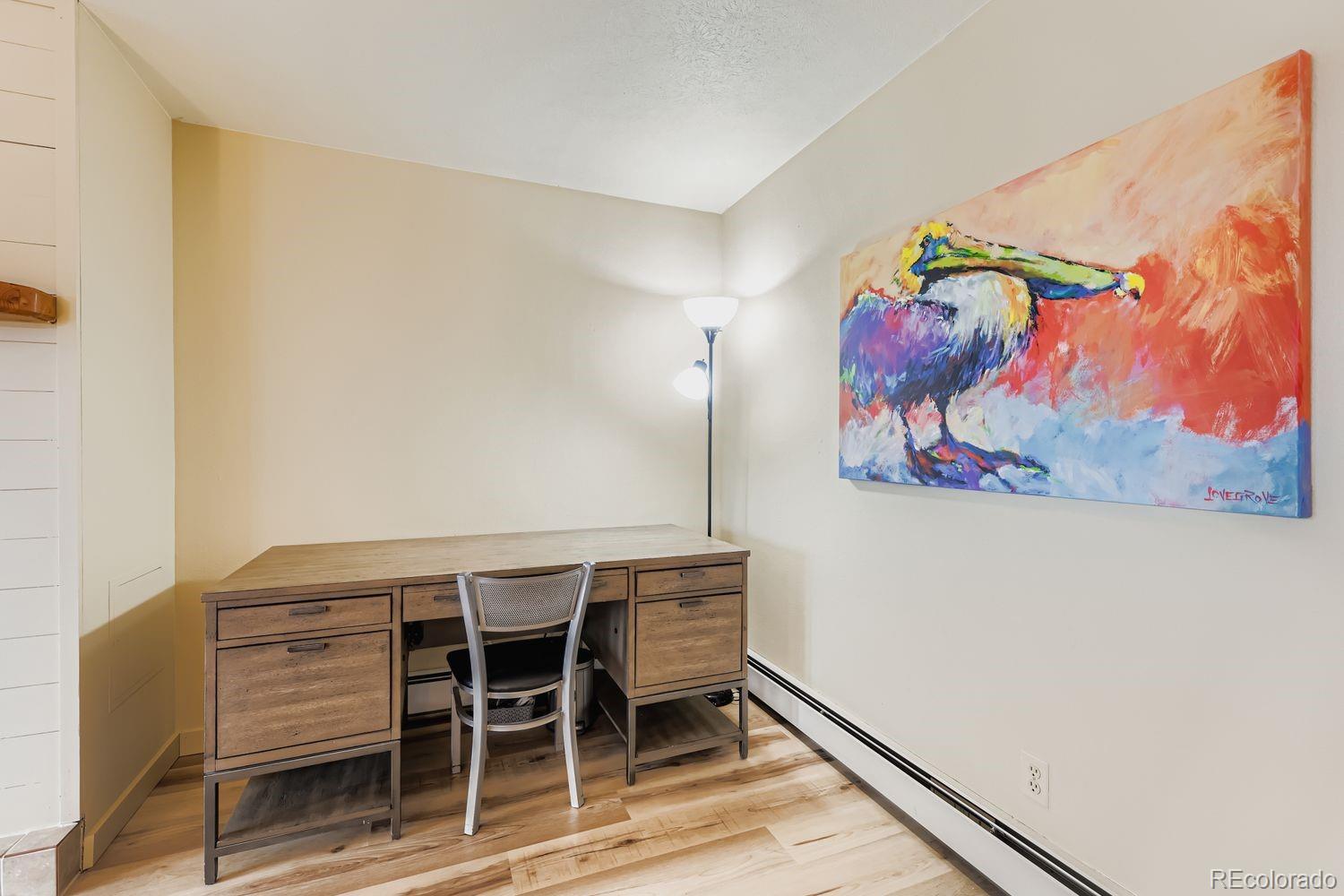 91300 Ryan Gulch Road, Unit 91305 Silverthorne, CO 80498 - Photo 11 of 40 a view of a room with wooden wall and table