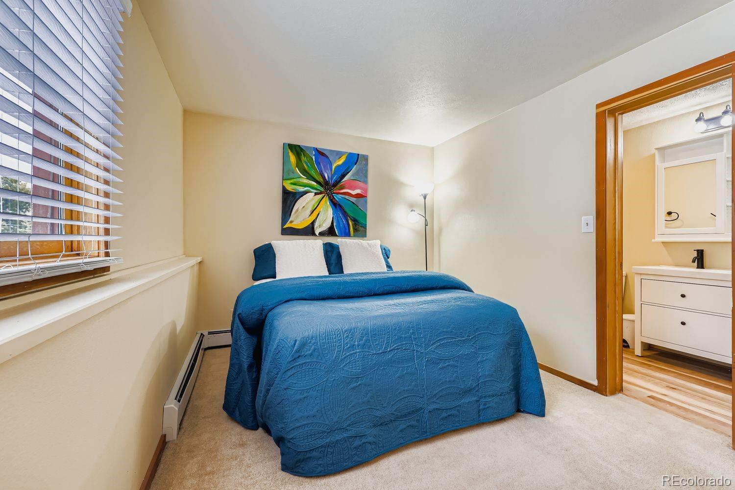 91300 Ryan Gulch Road, Unit 91305 Silverthorne, CO 80498 - Photo 13 of 40 a bedroom with a bed and a window