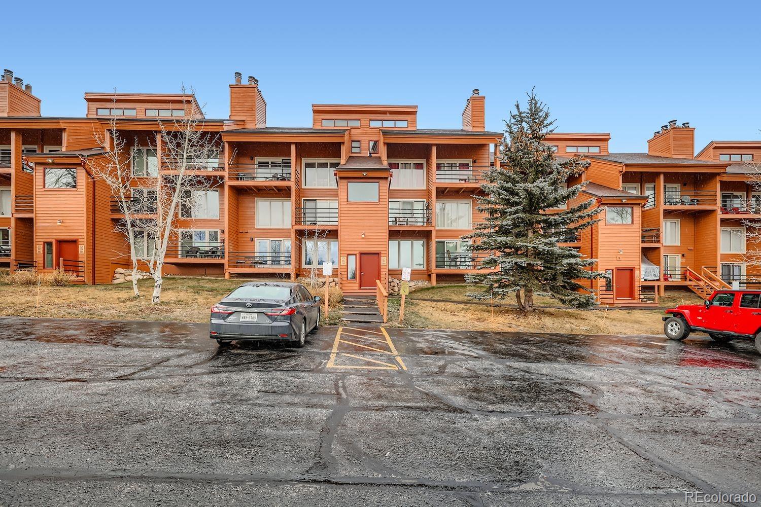 91300 Ryan Gulch Road, Unit 91305 Silverthorne, CO 80498 - Photo 23 of 40 a car parked in front of a building