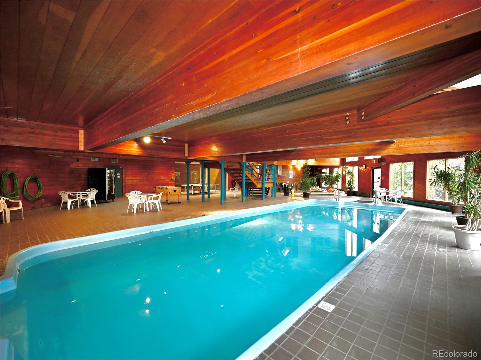 91300 Ryan Gulch Road, Unit 91305 Silverthorne, CO 80498 - Photo 29 of 40 a view of a swimming pool with a patio
