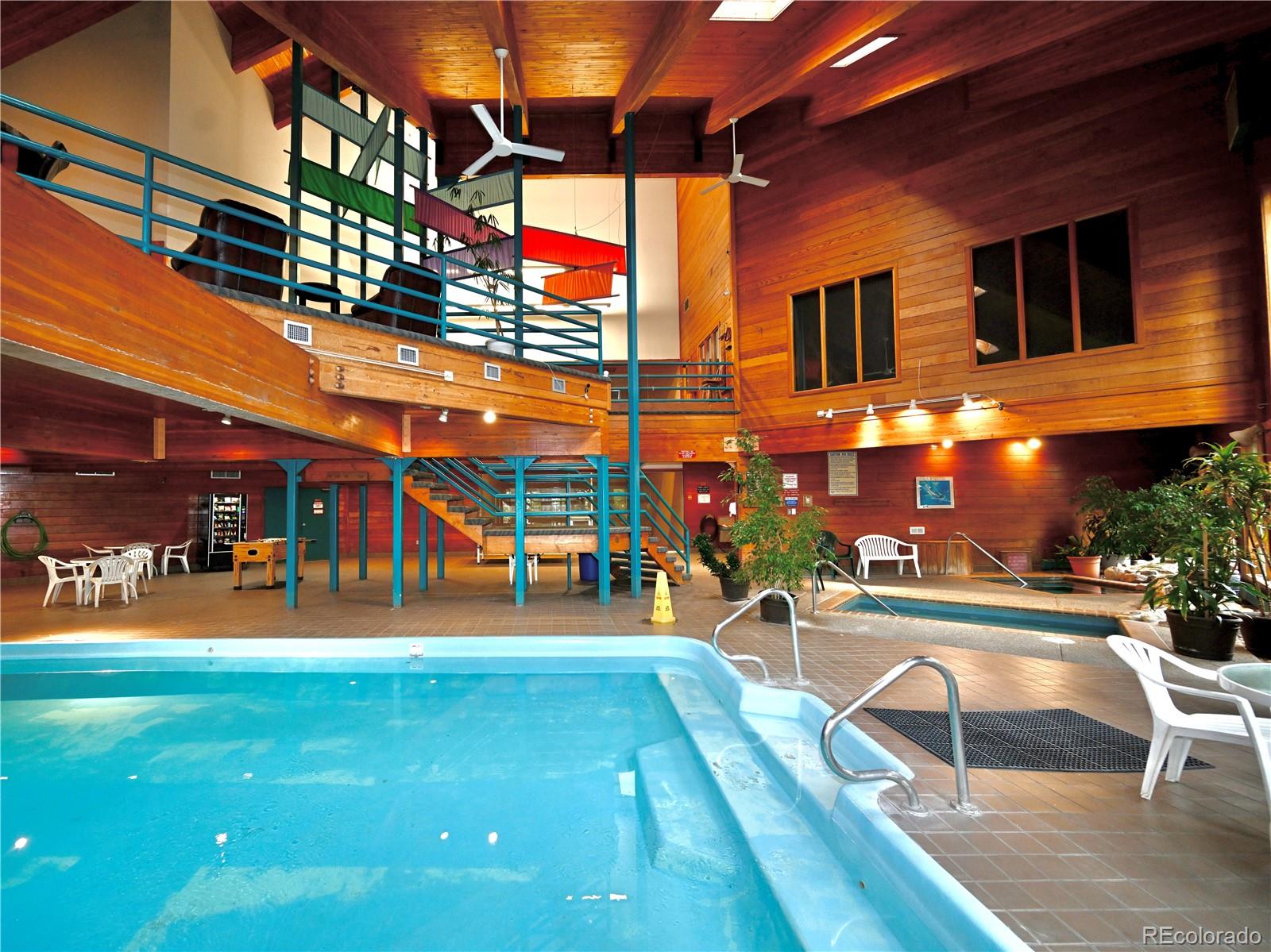 91300 Ryan Gulch Road, Unit 91305 Silverthorne, CO 80498 - Photo 31 of 40 a view of a building with a swimming pool