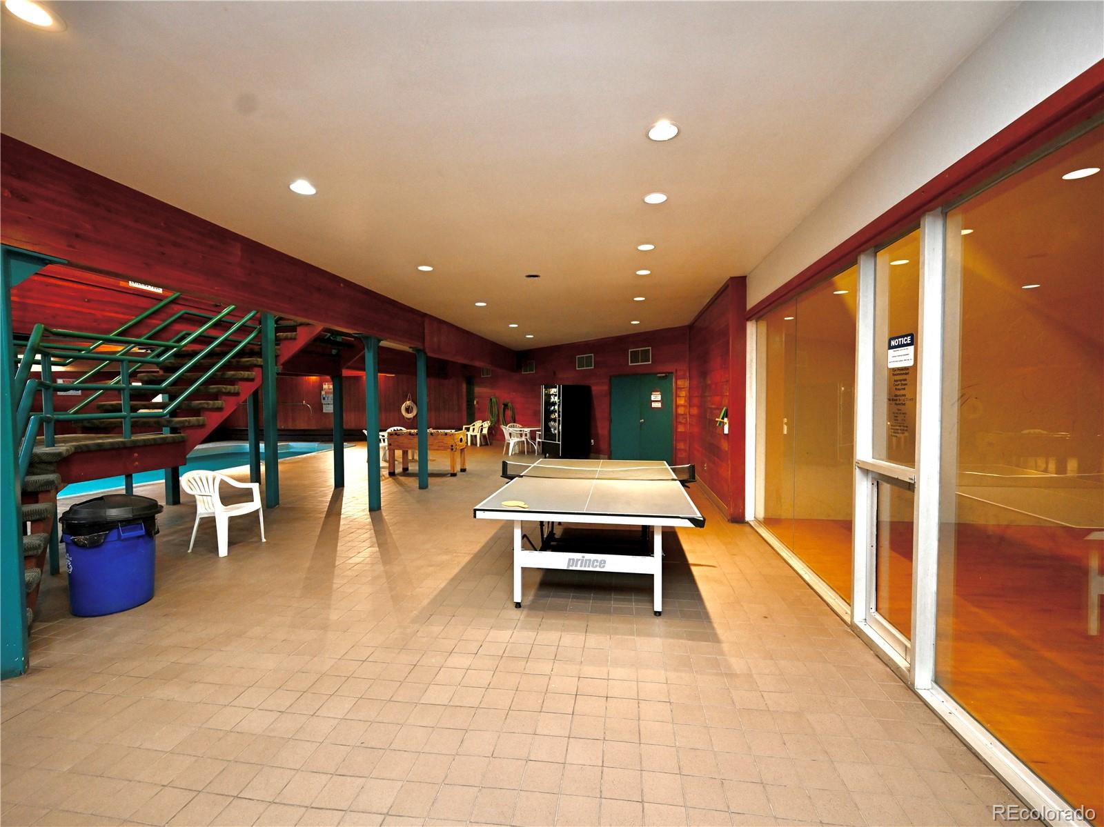 91300 Ryan Gulch Road, Unit 91305 Silverthorne, CO 80498 - Photo 34 of 40 a lobby with furniture and view of dining room