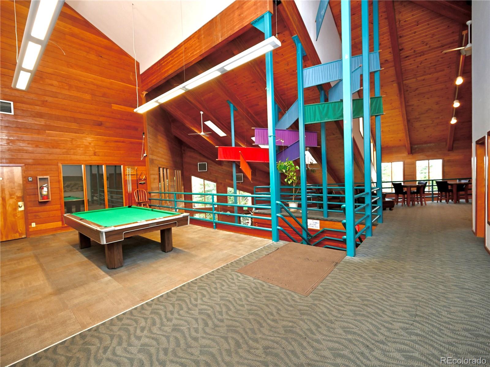 91300 Ryan Gulch Road, Unit 91305 Silverthorne, CO 80498 - Photo 35 of 40 a view of outdoor space with seating area and swimming pool