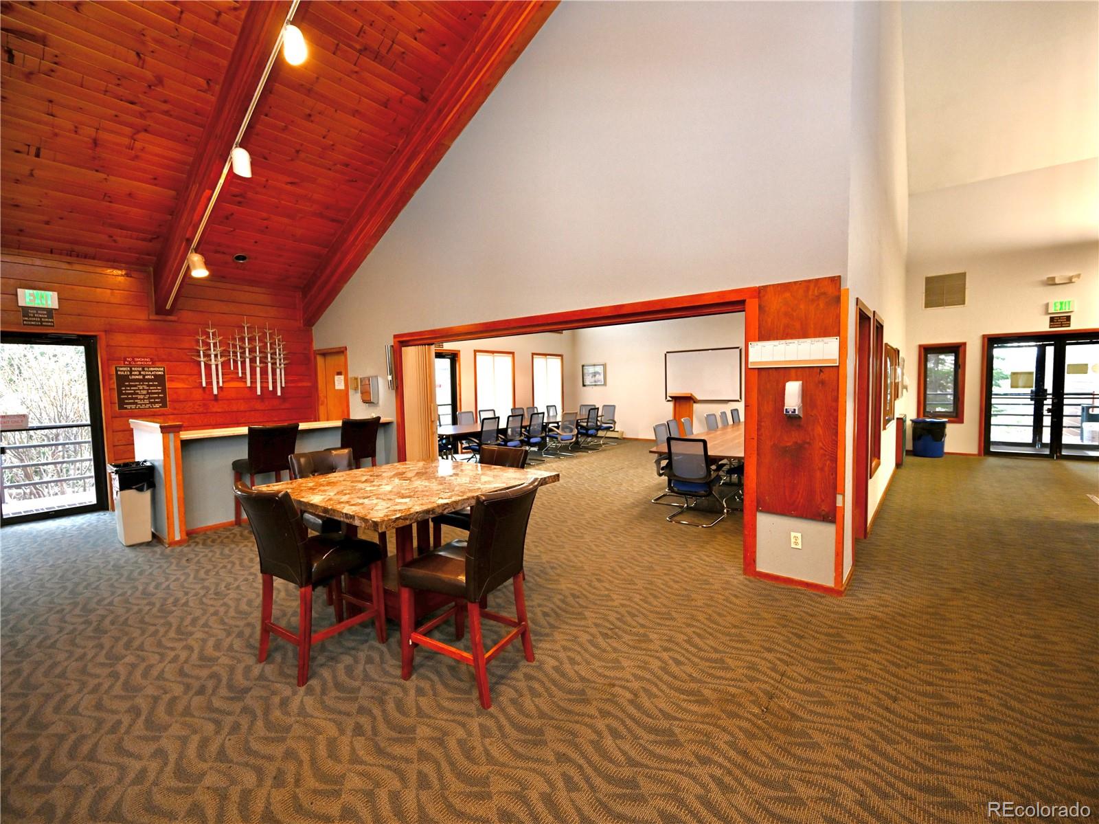91300 Ryan Gulch Road, Unit 91305 Silverthorne, CO 80498 - Photo 37 of 40 a dining room with furniture and a table