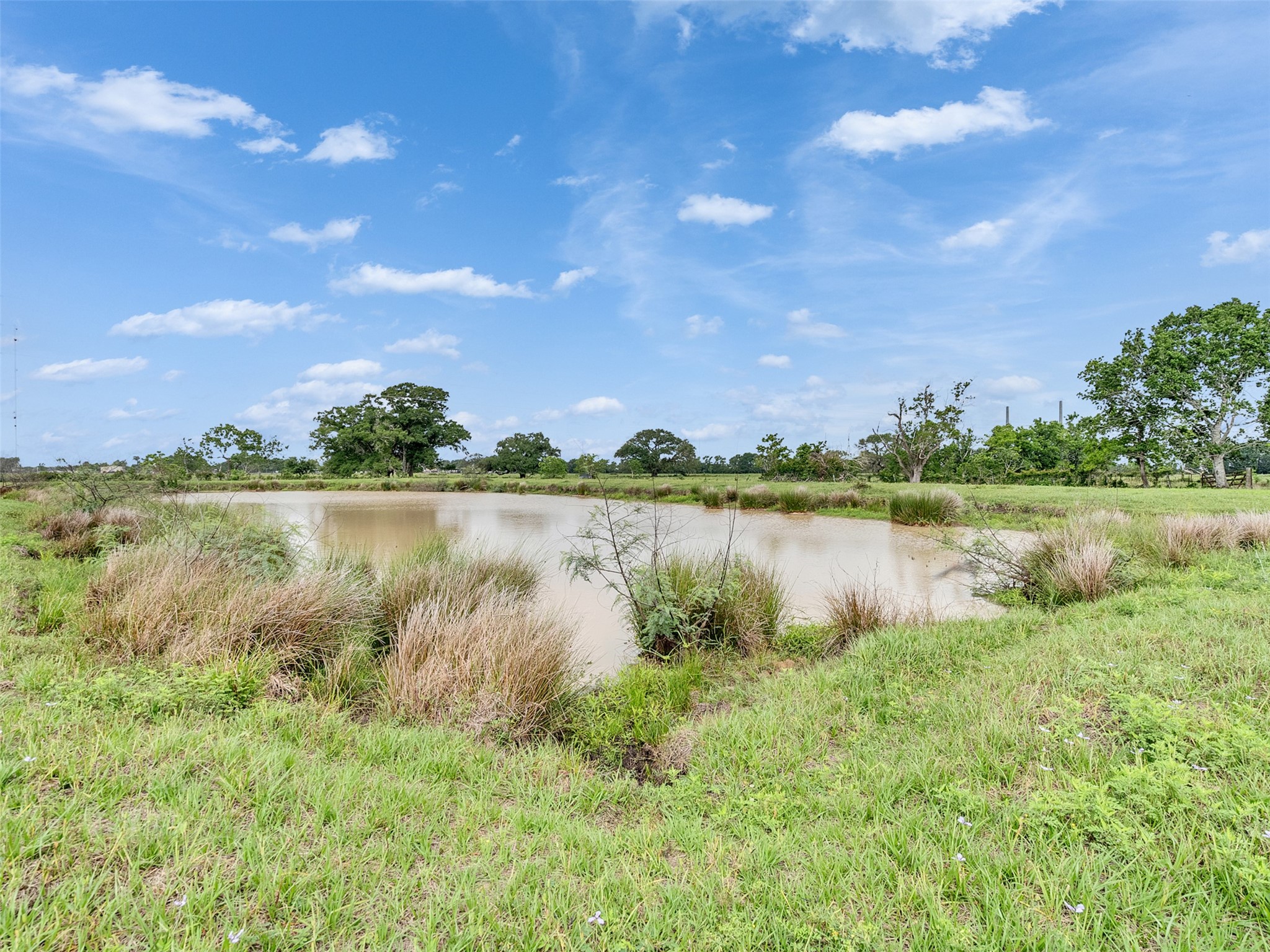 2100 Pine Knoll Road Bay City, TX 77414 - Photo 27 of 28 a view of a lake with houses in the back