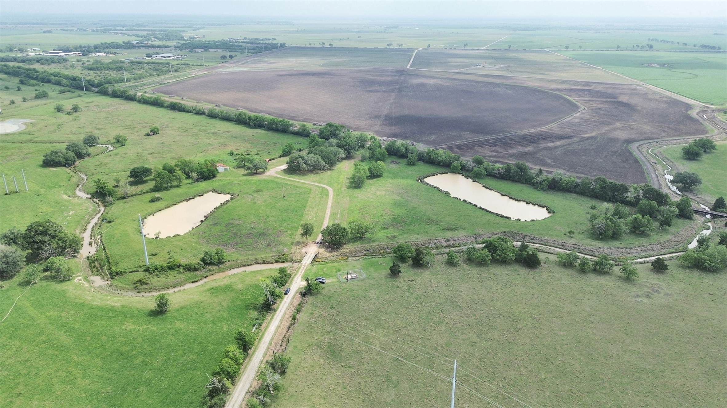 2100 Pine Knoll Road Bay City, TX 77414 - Photo 8 of 28 an aerial view of a houses with outdoor space and trees