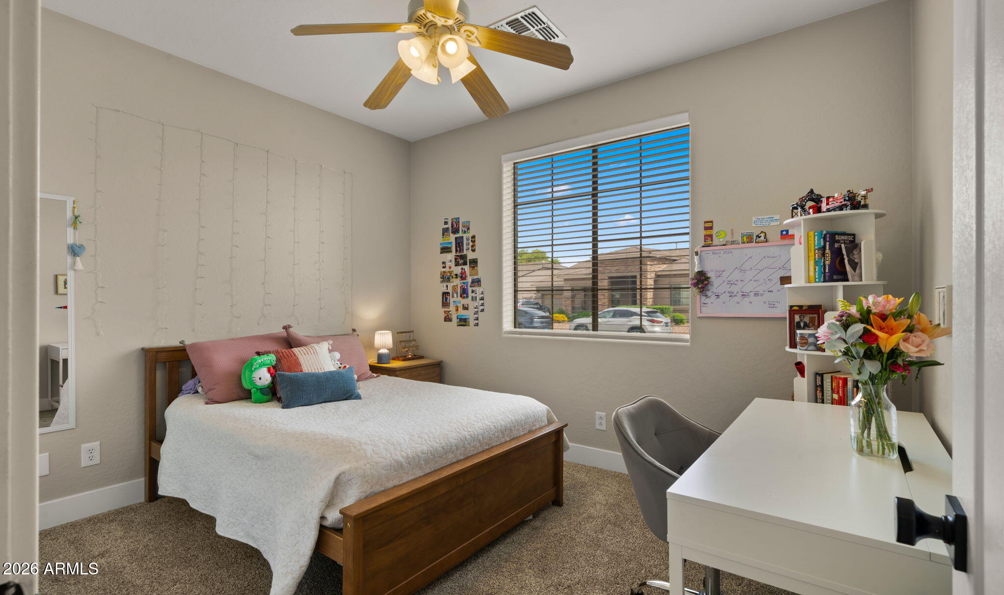 3344 East Hopkins Road Gilbert, AZ 85295 - Photo 17 of 32 a bedroom with a bed and a chandelier