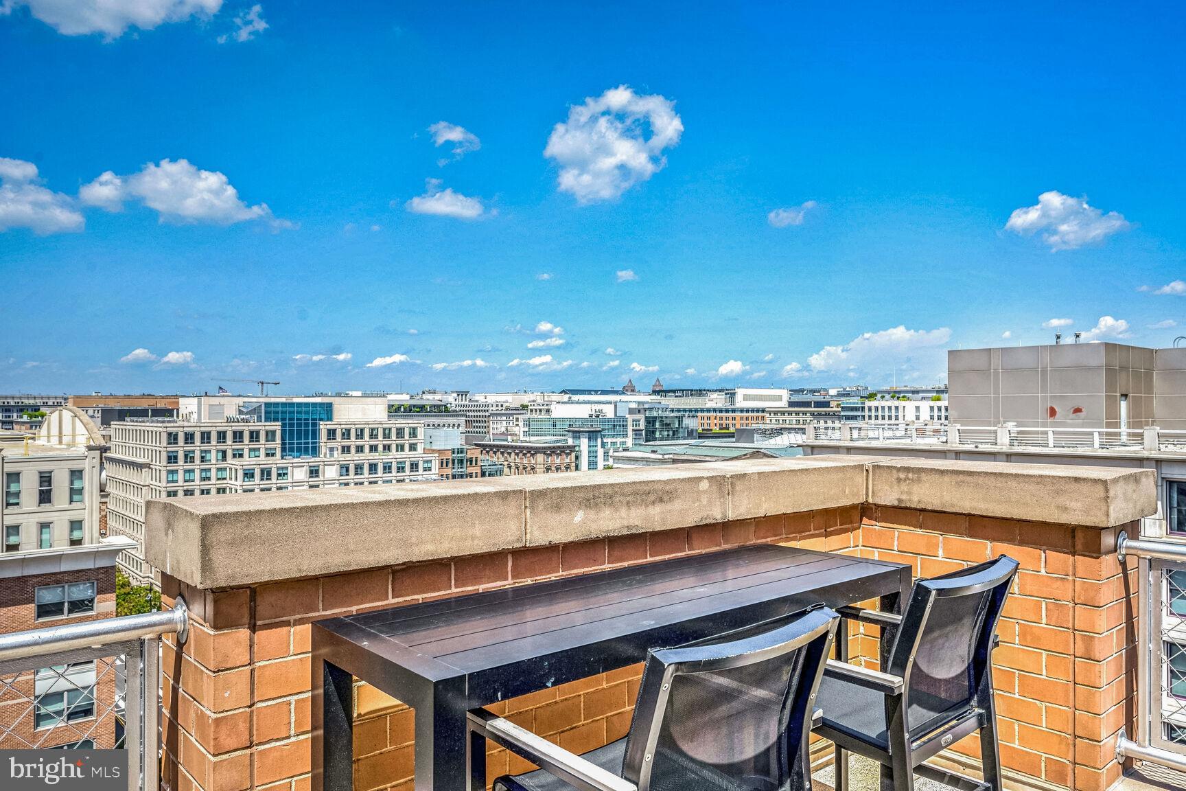616 E Street Northwest, Unit 1150 Washington, DC 20004 - Photo 74 of 75 a view of a chairs and table on the terrace