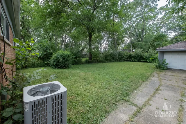 a view of a backyard with furniture