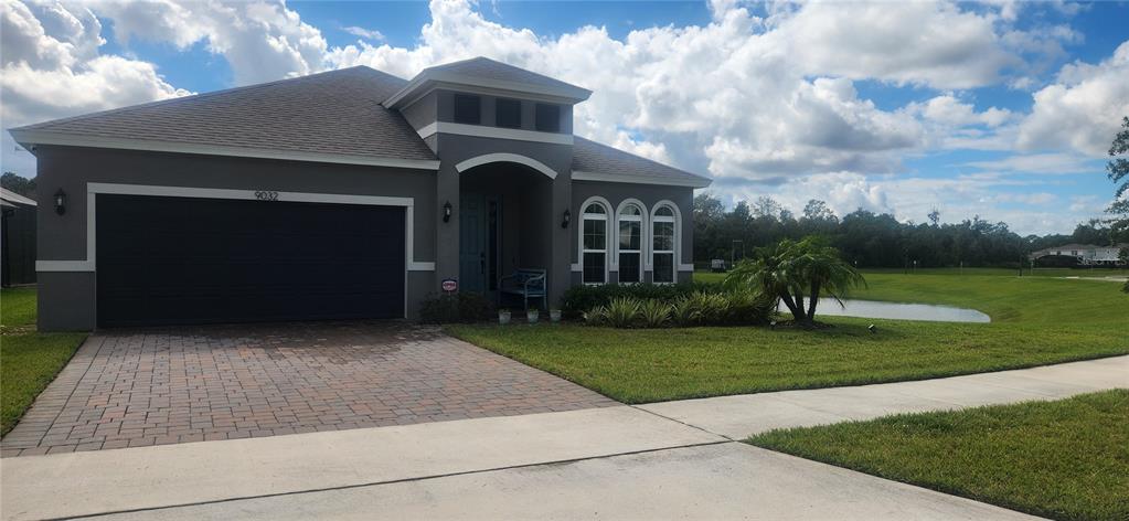 9032 Cape Cod Road DeLand, FL 32724 - Photo 16 of 16 a front view of a house with a yard
