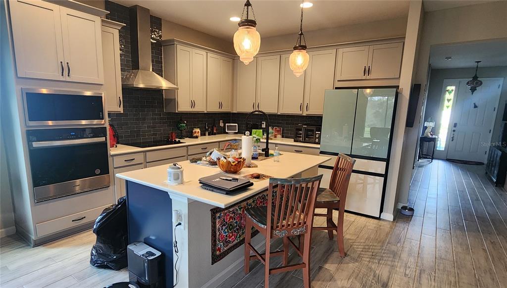 9032 Cape Cod Road DeLand, FL 32724 - Photo 6 of 16 a kitchen with granite countertop a sink appliances and cabinets