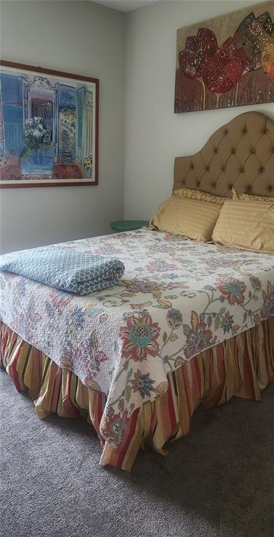 9032 Cape Cod Road DeLand, FL 32724 - Photo 9 of 16 a bedroom with a bed and wall painting